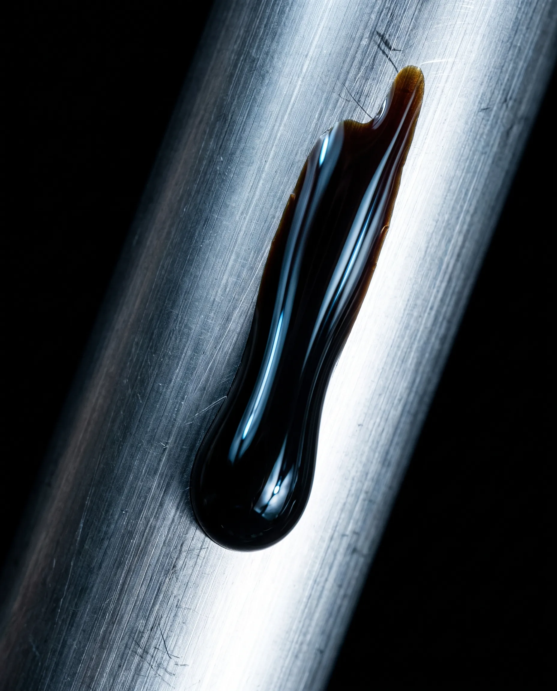 A drop of crude oil on polished steel